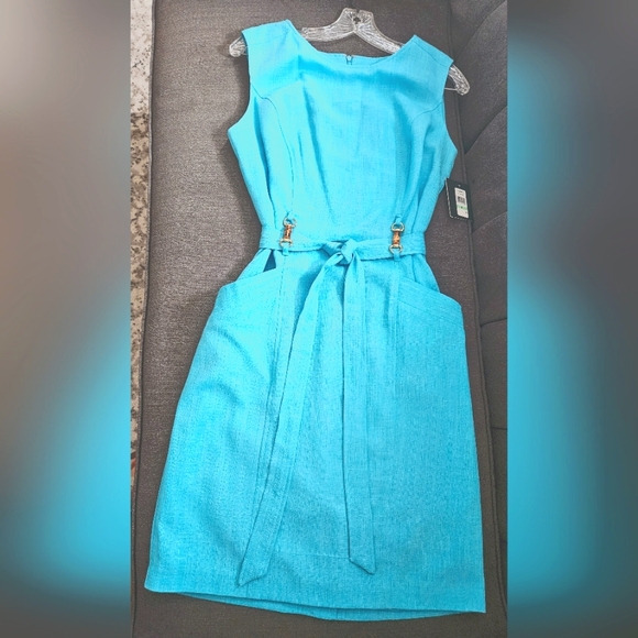 Cocktail length turquoise colored dress. Pockets and belt. Size 8 - Picture 1 of 7